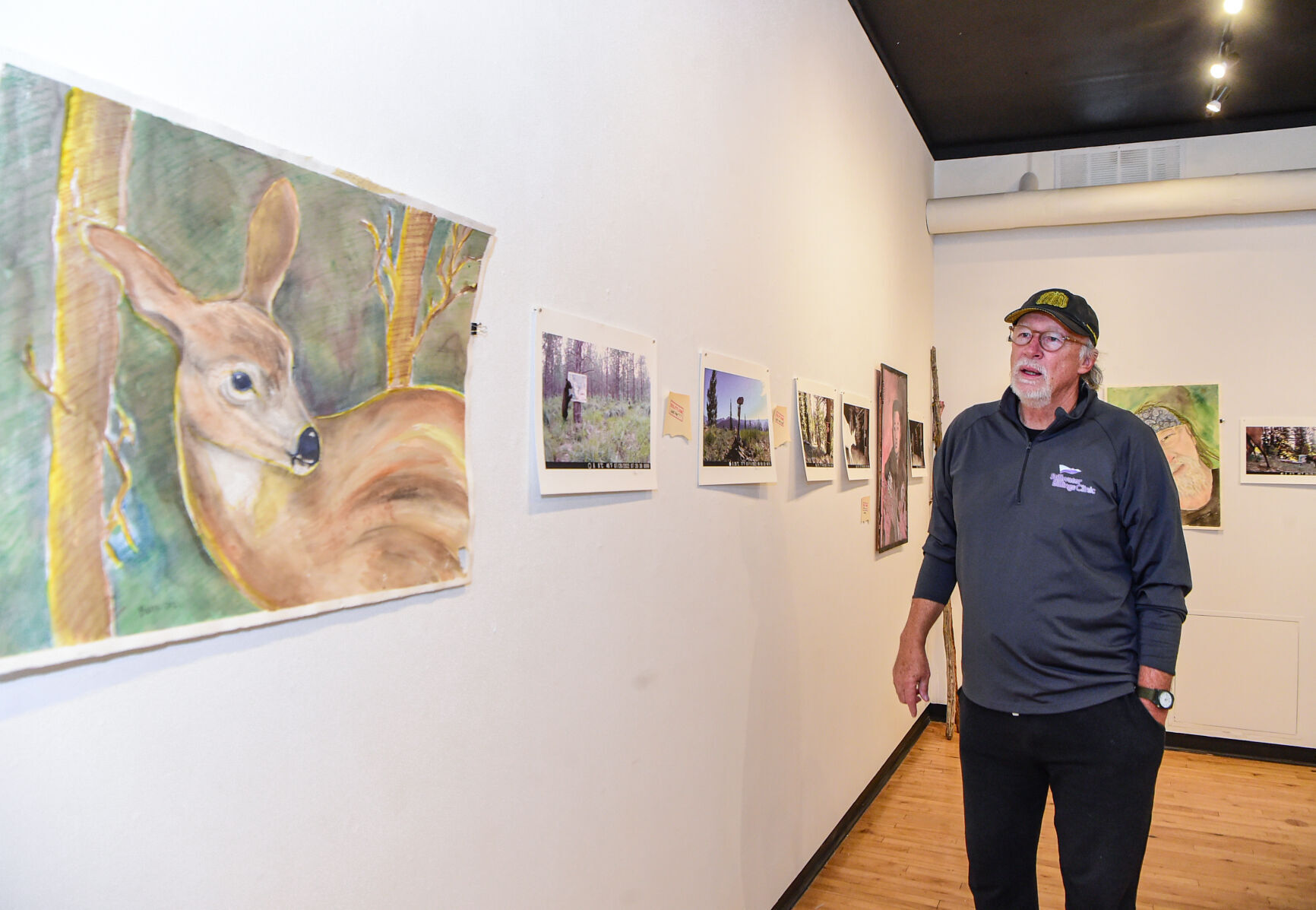 Jim Baken displays artwork for animals at Rocky